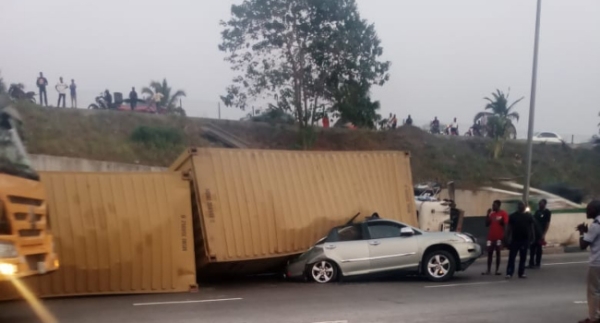 Couple Escapes Death As Container Falls On Vehicle In Lagos